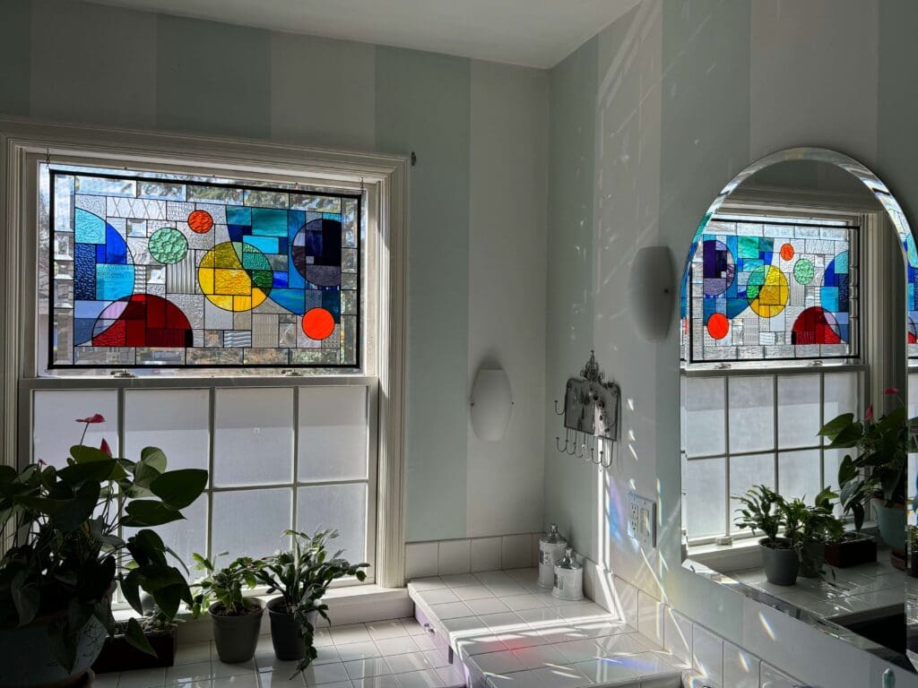 stained glass reflecting in a bathroom